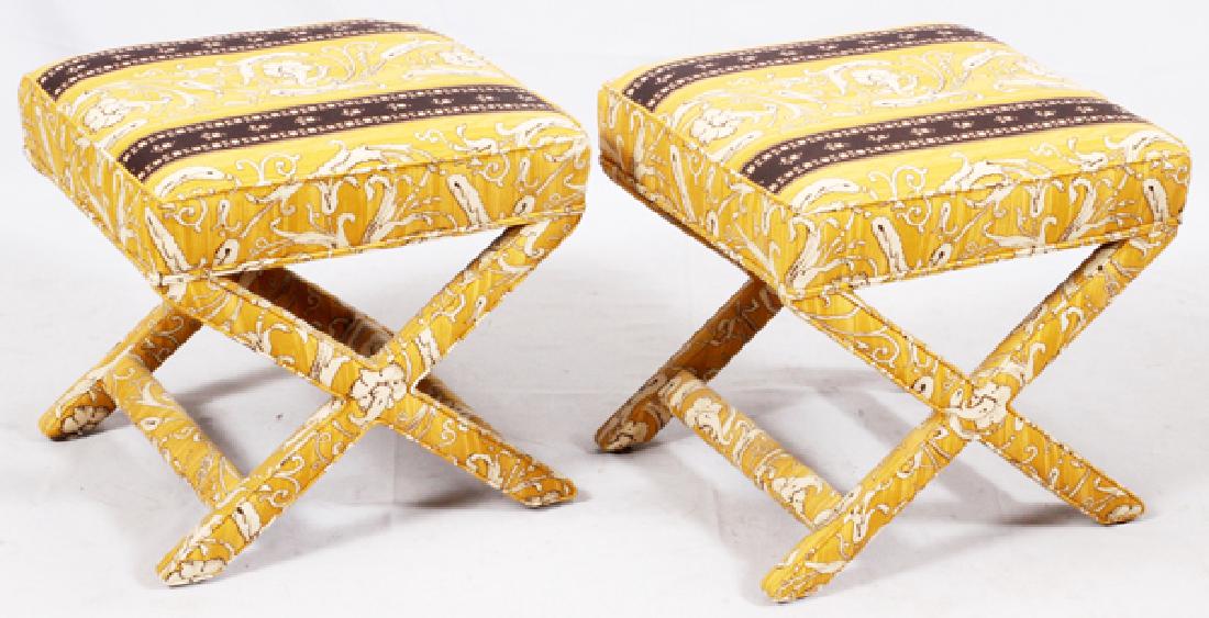 MID-CENTURY UPHOLSTERED STOOLS PAIR: MID-CENTURY UPHOLSTERED STOOLS, PAIR, H 19", W 18":A pair of upholstered stools with 'X' shaped stretchers, finished in gold and black fabric. Measures H.19" x 18 1/4" x 20 1/4".