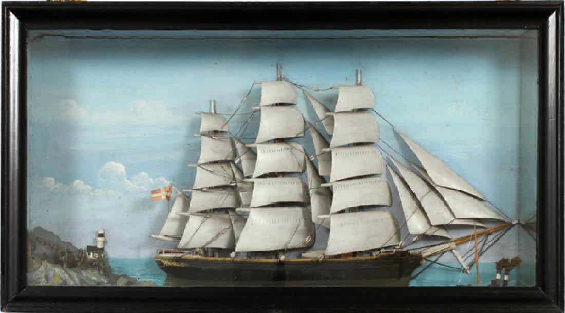 HALF SHIP MODEL IN SHADOWBOX 1881: HALF SHIP MODEL IN SHADOWBOX, 1881, H 16.75", W 32", D 5.5":A half ship model of a Danish Barque, at full sail, with a lighthouse in the background and a paddleboat steamer at the bow, displayed in a