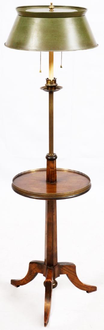 TWO-LIGHT FLOOR LAMP: TWO-LIGHT FLOOR LAMP H 49":A two-light floor lamp with table, central reeded brass shaft, candle form design and a metal tole shade. Chain pulls.