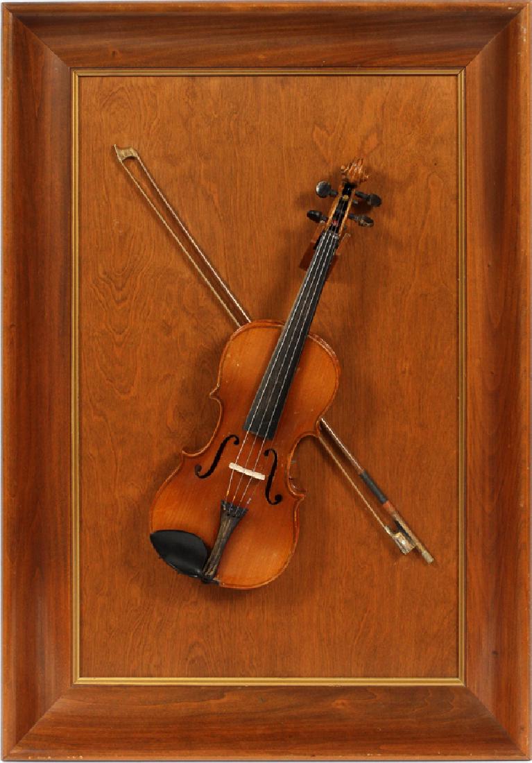 AFTER STRADIVARIUS VIOLIN FRAMED: AFTER STRADIVARIUS VIOLIN, FRAMED H 34" W 24" D 4":Mounted on a framed plaque with bow.