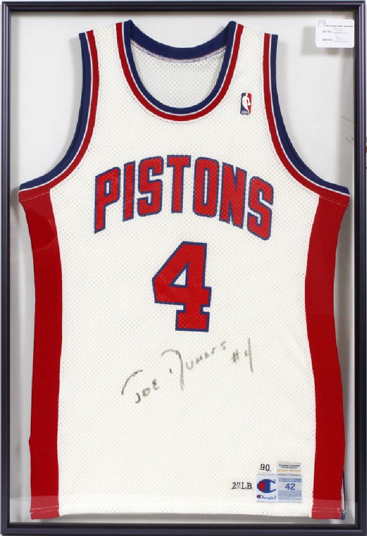 JOE DUMARS SIGNED PISTONS JERSEY: JOE DUMARS SIGNED PISTONS JERSEY, H 37", L 25":Commemorative NBA Detroit Pistons jersey signed by Joe Dumars below the number "4". Housed in an art preservation frame.