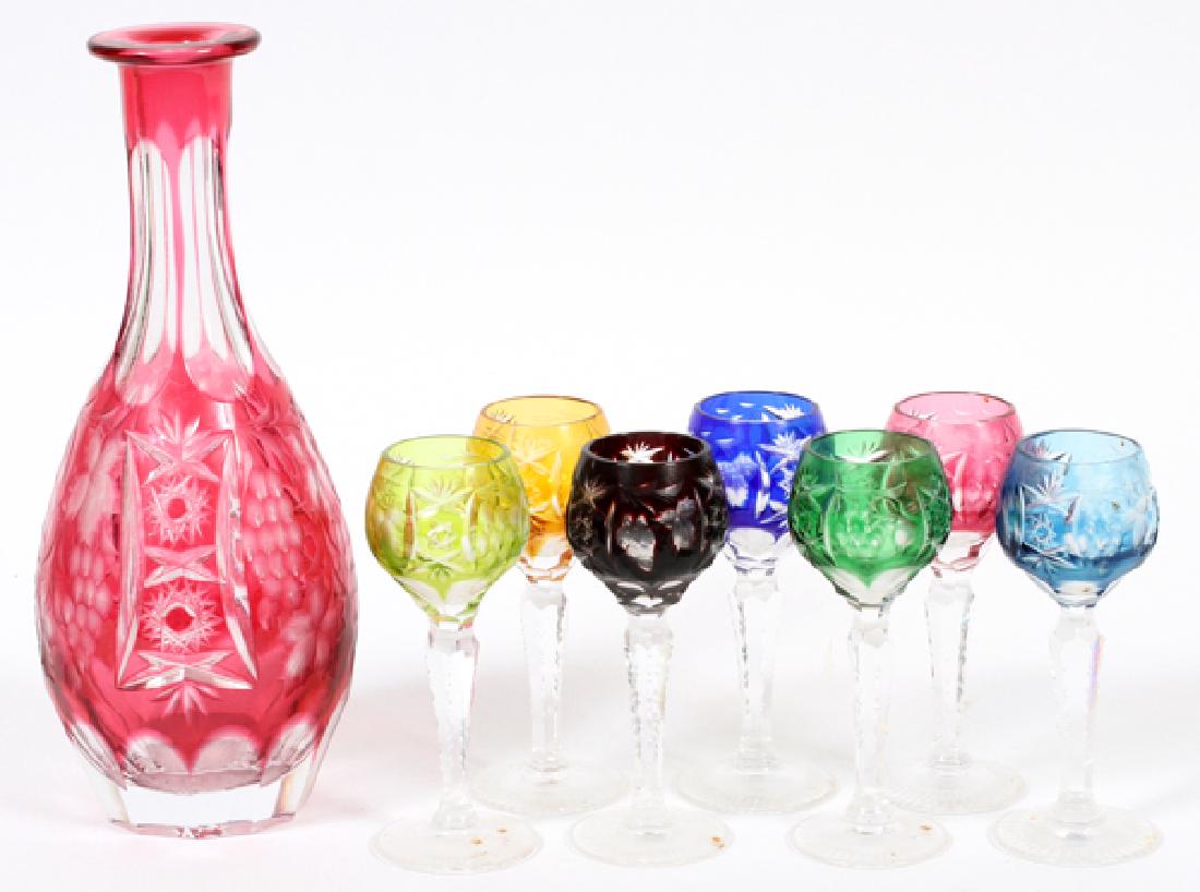 ETCHED & CUT GLASS DECANTER & CORDIALS: CZECHOSLOVAKIAN ETCHED AND CUT GLASS DECANTER AND CORDIALS, 8 PIECES, H 4 1/2"-9":Including 7 cordials in shades of yellow, blue, red, and green; together with a matching decanter (lacking stopper) de