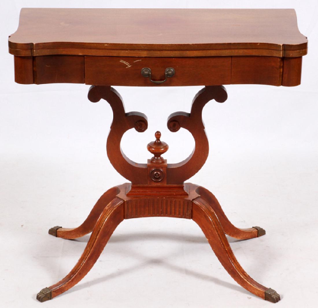 MERSMAN DUNCAN PHYFE MAHOGANY GAMES TABLE: MERSMAN DUNCAN PHYFE MAHOGANY GAMES TABLE, H 29", L 31.75", D 16":Four legs under lyre and urn form base under a flip-top games table. Extended depth 32". Marked on the underside of the drawer Mersman