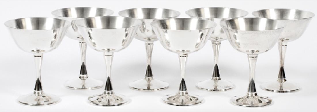SALEM PORTUGAL SILVER PLATE CHAMPAGNES SET OF 8: SALEM PORTUGAL SILVER PLATE CHAMPAGNES, SET OF 8, H 4 3/4":A set of 8 silver plate champagne stems; marked at the underside 'Salem Portugal'. From the collection of Mrs. G. G. Scranton, international 