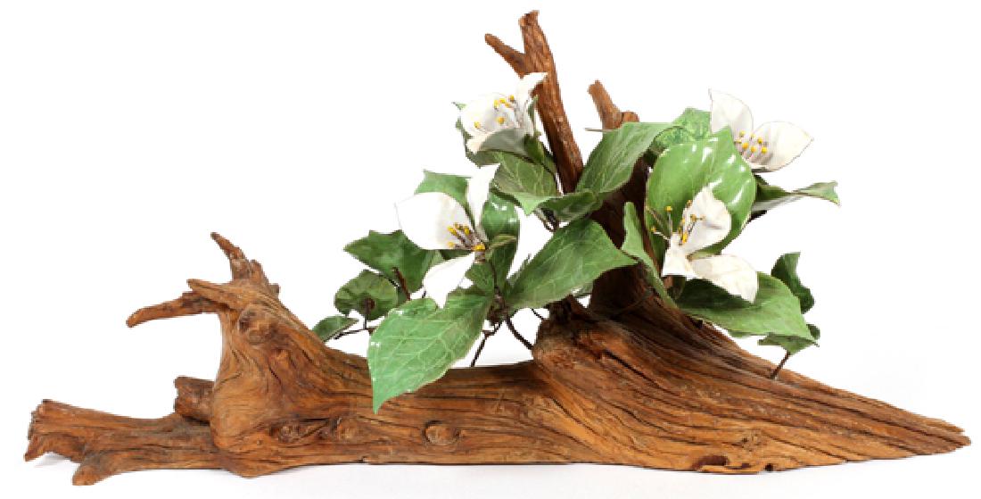 NORMAN BRUMM ENAMELED METAL AND WOOD SCULPTURE: NORMAN BRUMM (AMERICAN, 1938-2008) ENAMELED METAL AND WOOD SCULPTURE, H 23 1/4", W 10 3/4":Enameled metal sculpture of trillium blossoms, mounted on a wood base. With signature impressed to bottom.