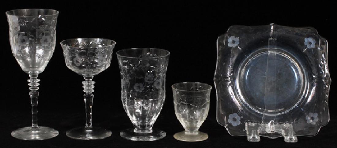 ETCHED CRYSTAL STEMWARE AND PLATES 23 PIECES: ETCHED CRYSTAL STEMWARE AND PLATES, 23 PIECES, H 3 1/4"-7 1/2":The set decorated in an etched floral motif, unmarked. Includes 4 water goblets, H.7 1/2", 2 red wine glasses, H.6", 2 white wine glasses