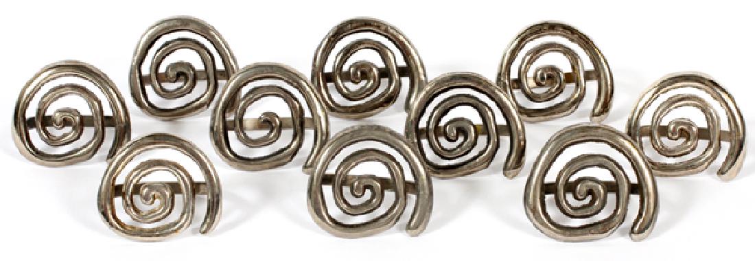 SILVER PLATE SWIRL FORM NAPKIN RINGS SET OF TEN: SILVER PLATE SWIRL FORM NAPKIN RINGS, SET OF TEN, W 2":No apparent markings.