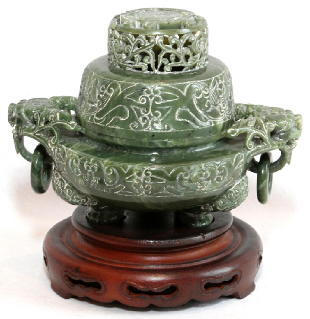 CHINESE SERPENTINE INCENSE BURNER: CHINESE SERPENTINE INCENSE BURNER, H 5" W 7":Dragon form handles holding rings, raised on tripod base, with teakwood base measuring 1 3/4".