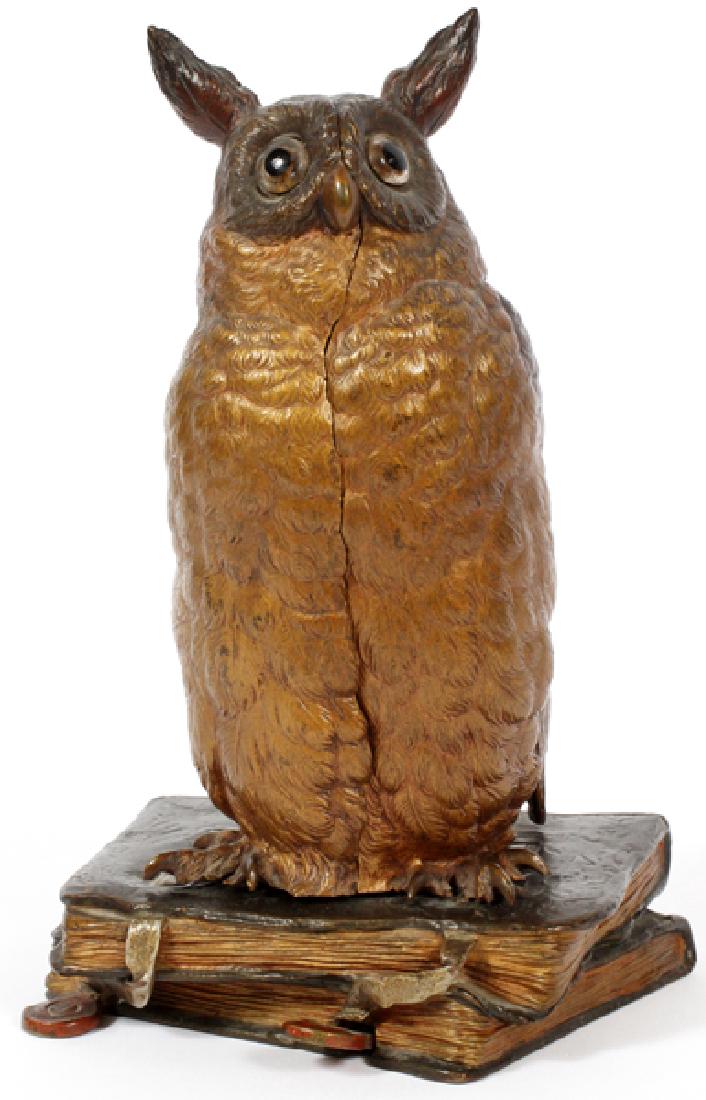 FRANZ XAVER BERGMANN COLD PAINTED BRONZE SCULPTURE: FRANZ XAVER BERGMANN (AUSTRIAN, 1861-1936), COLD PAINTED BRONZE SCULPTURE, H 7 3/4":The figure of a horned owl seated atop a stack of books, depressed level opens the owl with a standing nude female h