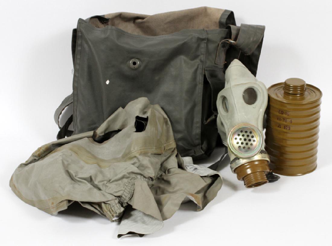 EAST GERMAN SOVIET GAS MASK PACK C1950: EAST GERMAN SOVIET GAS MASK PACK, 11 1/2" X 11 1/2" X 5" C1950:East German Soviet gas mask pack.