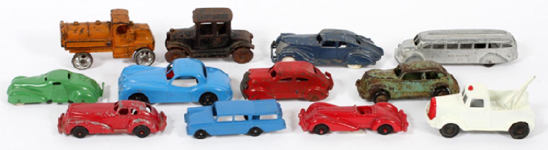 TOOTSIE TOY HUBLEY MANOIL AND ARCADE METAL TOY CARS: TOOTSIE TOY, HUBLEY, MANOIL AND ARCADE, METAL TOY CARS AND TRUCKS, 12 PCS. L 4" - 6":Includes: Tootsie Toy Jaguar, Nash Rambler, Greyhound bus, tow truck; Hubley blue 2 door sedan, two Manoil Toys, #7