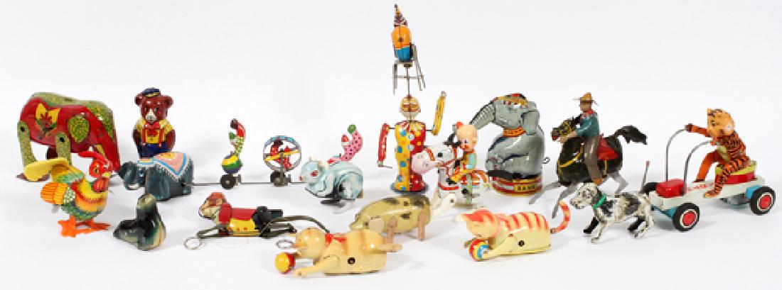 TIN LITHO CIRCUS-THEMED TOYS TEN: TIN LITHO CIRCUS-THEMED TOYS, TEN, H 2 1/4"-9 1/2":Includes various circus animals, bears, cats, elephants, a monkey, and others. Together with figural litho toys.