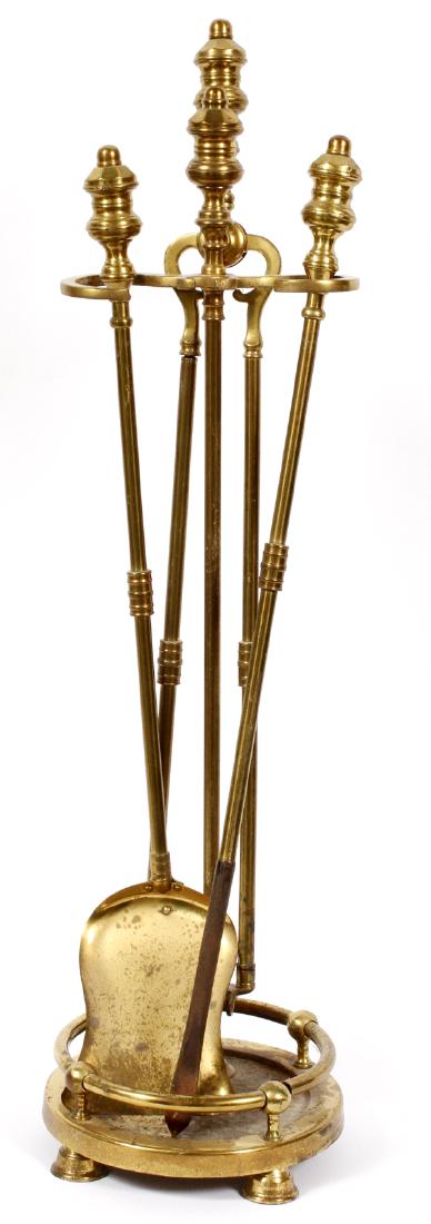 A THREE PIECE BRASS FIRE TOOL SET (1 of 2)
