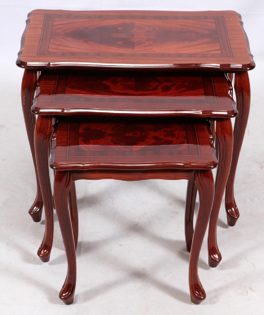MAHOGANY NESTING TABLES 3: MAHOGANY NESTING TABLES, 3, H 17" - 20", W 15" - 24", D 11" - 16":having burlwood inlaid tops with contoured edges, cabriolet legs.