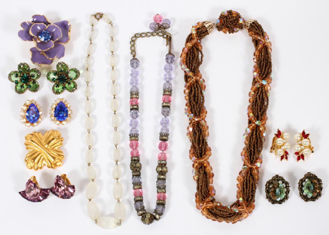 FENDI KENNETH JAY LANE & UNMARKED COSTUME JEWELRY: FENDI, KENNETH JAY LANE, AND UNMARKED COSTUME JEWELRY GROUPING, 10 PCS:Including one gilt Fendi pin measuring L 1.75", W 1.75"; one Kenneth Jay Lane purple enamel flower brooch measuring L 2", W 2", w