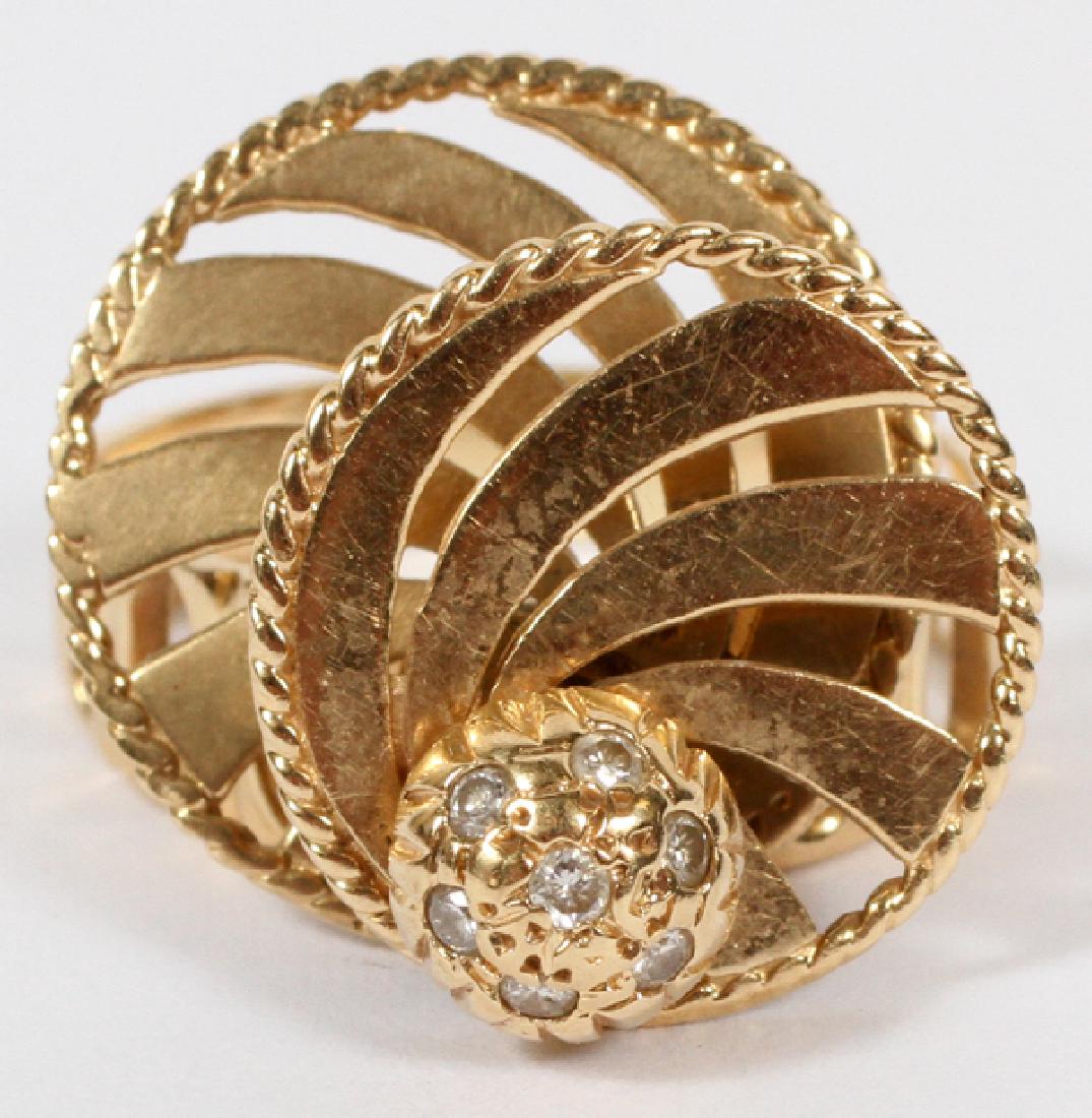 14KT YELLOW GOLD AND PAVE DIAMOND SWIVEL RING: 14KT YELLOW GOLD AND PAVE DIAMOND SWIVEL RING, SIZE 9-9.25:A 14kt yellow gold shank with two stacked swivel discs and pave diamond center. Weighs 8 grams.