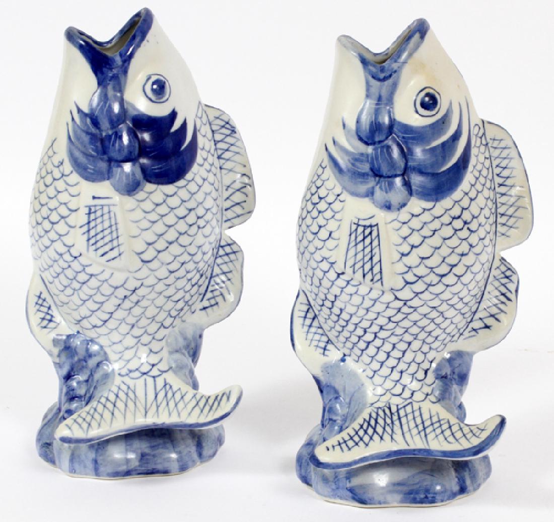 CHINESE STYLE POTTERY FISH FORM VASES PAIR: CHINESE STYLE POTTERY FISH FORM VASES, PAIR, H 10":Blue and white design.