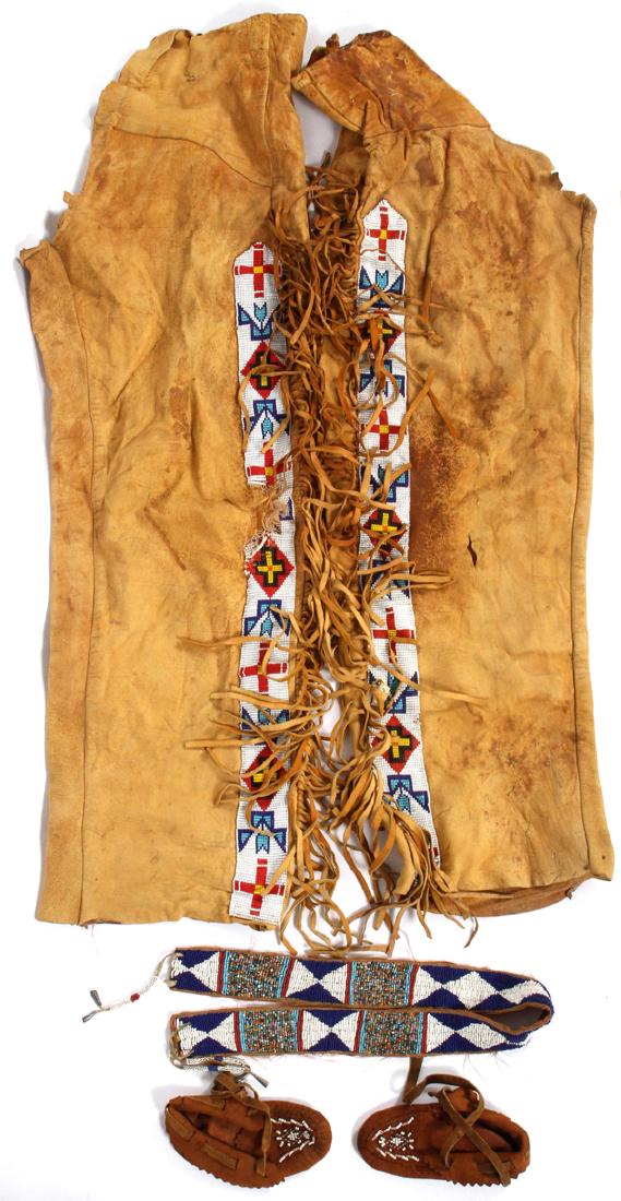 NATIVE AMERICAN RAWHIDE LEGGINGS MOCCASINS & BELT: NATIVE AMERICAN RAWHIDE LEGGINGS, MOCCASINS AND BEADED BELT, 5 PCS.,:a pair of Native American rawhide leggings with fringe and beading. Child's beaded belt and pair of rawhide moccasins.