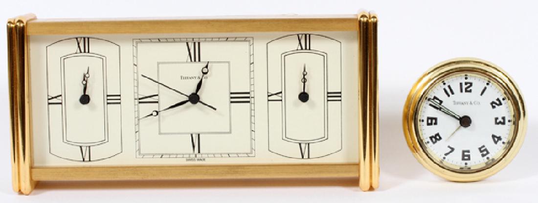 TIFFANY & CO. BRASS CLOCKS TWO: TIFFANY & CO. BRASS CLOCKS, TWO, H 3 3/8" W 7 1/4", D 1 1/4":Comprising one Tiffany & Co. brass desk clock, and one Tiffany & Co. round traveling clock. The traveling clock is accompanied by the origi