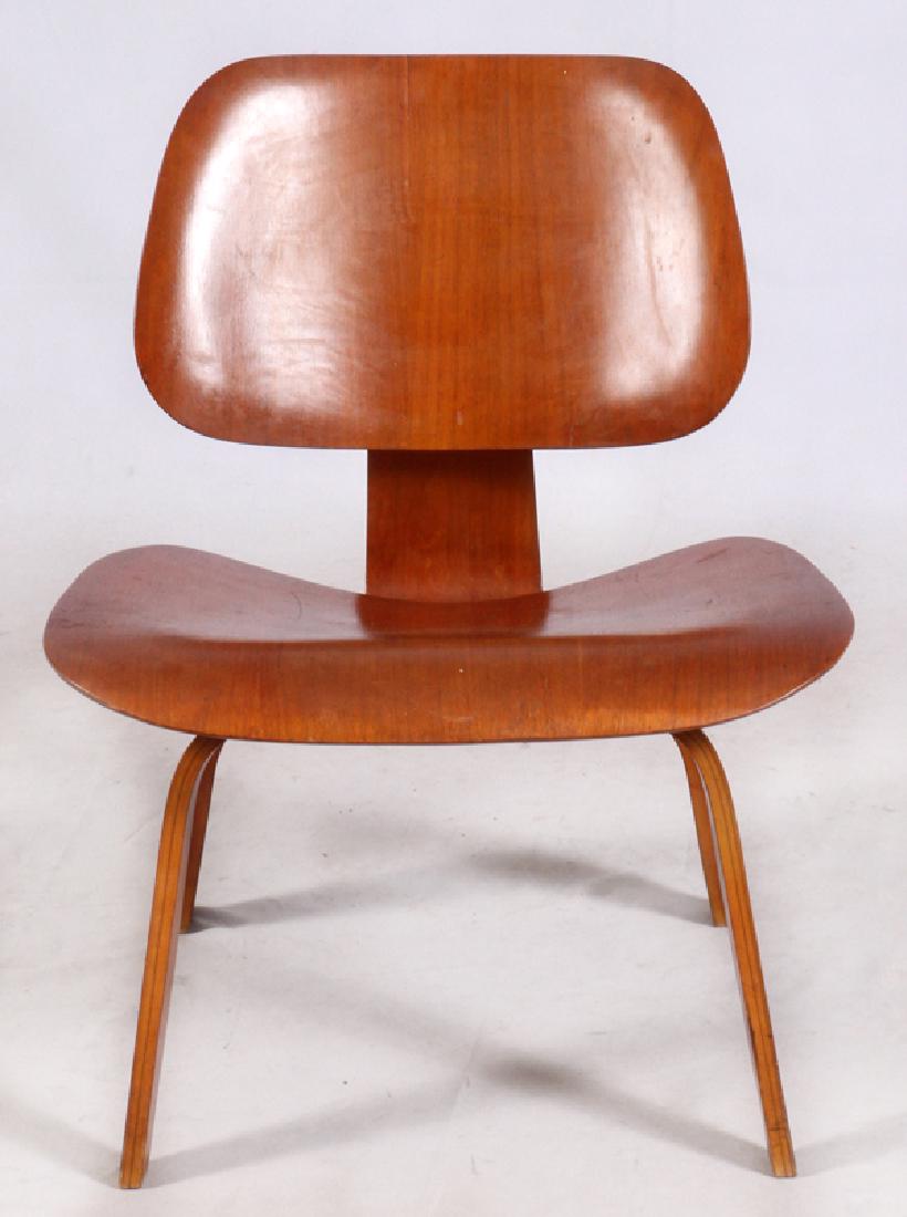 CHARLES EAMES FOR HERMAN MILLER LOUNGE CHAIR: CHARLES EAMES FOR HERMAN MILLER, MOLDED PLYWOOD LOUNGE CHAIR, C1947-1949, H 26", W 22":Early Charles Eames DCW Chair by Evans. The label underneath this chair indicates that it was manufactured by Eva