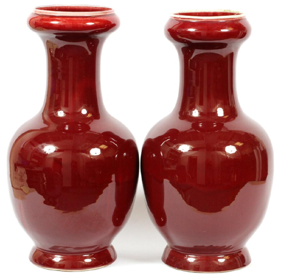 CHINESE OX BLOOD BALUSTER VASES PAIR: CHINESE OX BLOOD BALUSTER VASES, PAIR, H 21":.