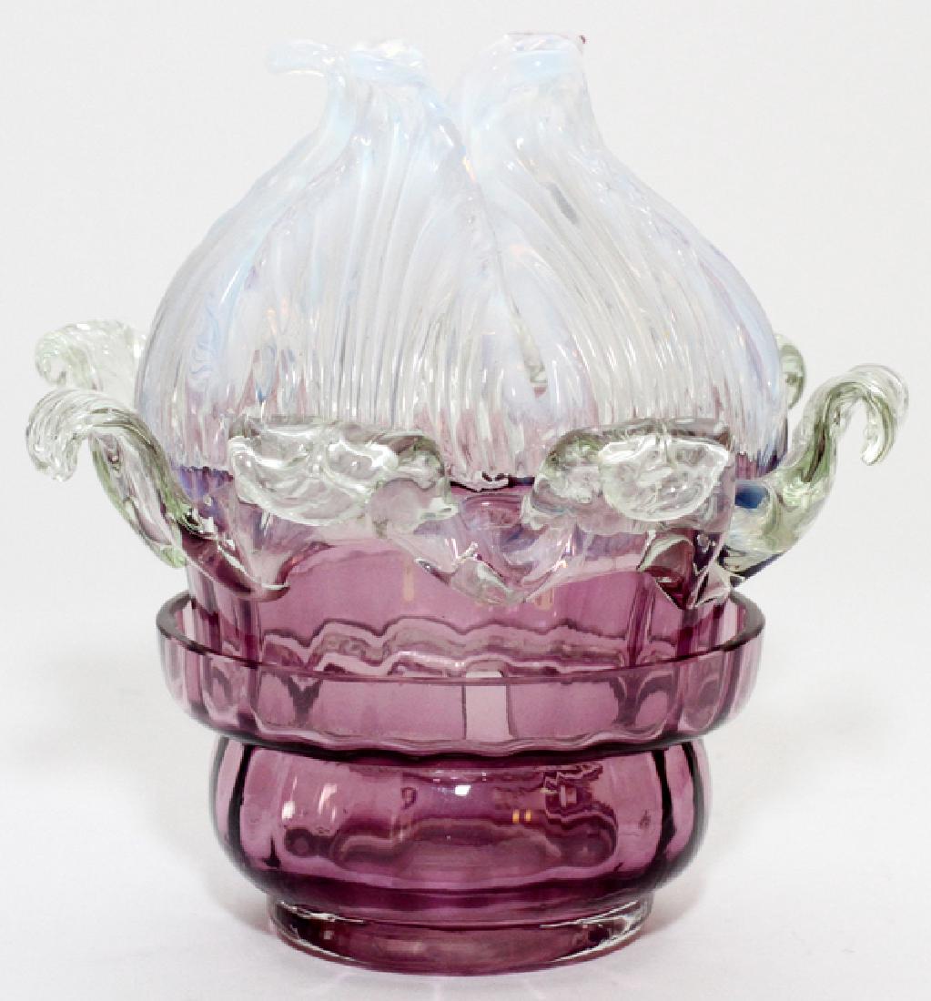 VICTORIAN APPLIED GLASS FAIRY LAMP: VICTORIAN APPLIED GLASS FAIRY LAMP, LATE 19TH/EARLY 20TH C., H 5 1/2", DIA 5 1/2":Amethyst to opalescent, floral style, scrolling leaf. From the Estate of Dr. Henry and Grace Stricker, Milford, Michig