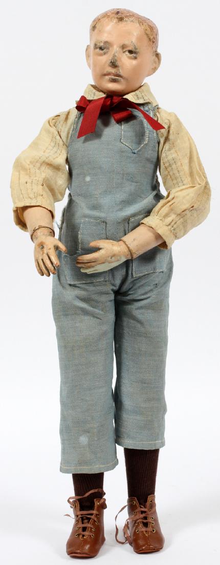 RARE SCHOENHUT MANIKIN DOLL C.1914-1918: RARE SCHOENHUT MANIKIN DOLL, C.1914-1918, H 19":Fully-jointed, figure 19/175/4, dressed as a farmer, with original shirt and overalls. No apparent markings. Reference: Schoenhut Dolls, A Collector's E