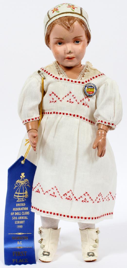 SCHOENHUT CARVED WOOD PAINTED BONNET DOLL C.1912: SCHOENHUT CARVED WOOD PAINTED BONNET DOLL, C.1912, H 16":With ribbon reading: United Federation of Doll Clubs, 50th Annual Exhibition, 1999, 1st Place Ribbon. With jointed limbs and painted bonnet dec