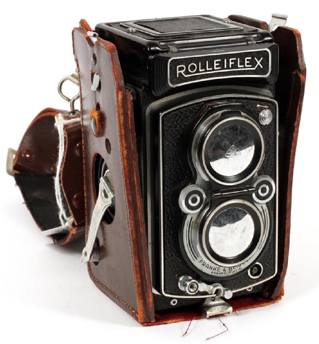 ROLLEIFLEX AUTOMAT CAMERAMID 20TH C.: ROLLEIFLEX, AUTOMAT CAMERA (MODEL K4), MID 20TH C., H 5 1/2", W 3":Serial no. 1152994, with a Schneider Xenar 75mm f3.5 lens, accompanied by a fitted leather case.