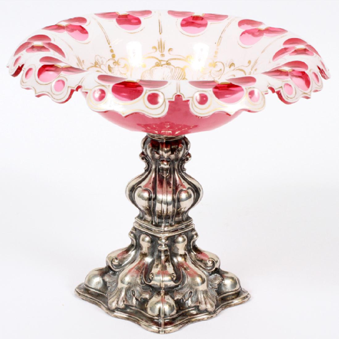 BOHEMIAN GLASS & SILVER COMPOTE C 1870: BOHEMIAN GLASS & SILVER COMPOTE, C 1870, H 7", DIA 8":Having a Bohemian glass in white and pink floral design dish with fired gold in the well. Mounted on a silver plate pedestal base (weighted) with 