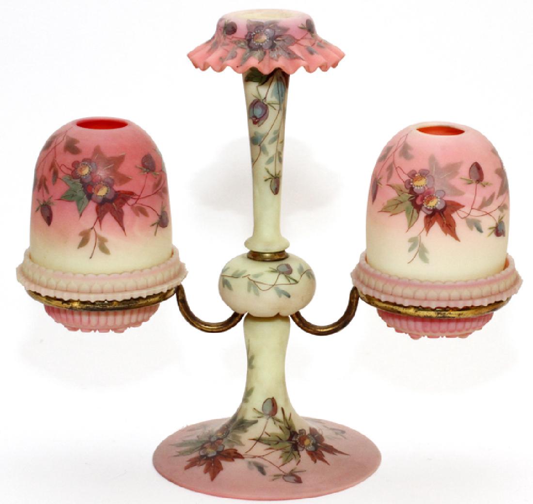 ATTRIB. THOMAS WEBB & SONS FAIRY LAMP EPERGNE: ATTRIB. THOMAS WEBB & SONS BURMESE FAIRY LAMP EPERGNE, LATE 19TH C., H 10 3/4", W 11 1/2":Having two Burmese pyramid-size domes decorated in prunus pattern, the lamp cups set in an ormolu frame and ma