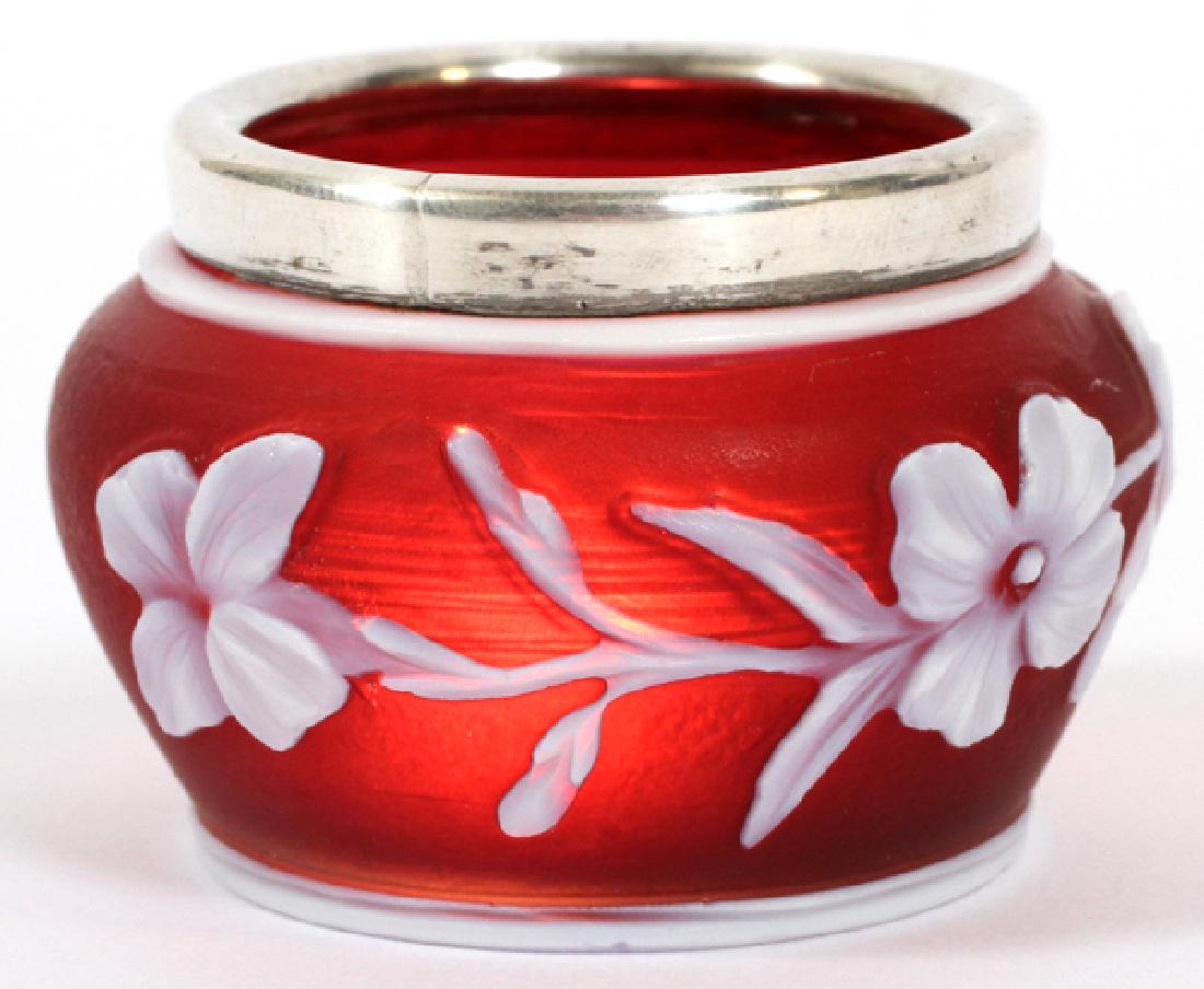 ENGLISH CAMEO GLASS OPEN SALT LATE 19TH C.: ENGLISH CAMEO GLASS OPEN SALT, LATE 19TH C., H 1 1/8", D 1 3/4":Probably Thomas Webb & Sons, fourth quarter 19th century. The cameo-cut white-over-mauve-over red glass vase in floral décor, and the r