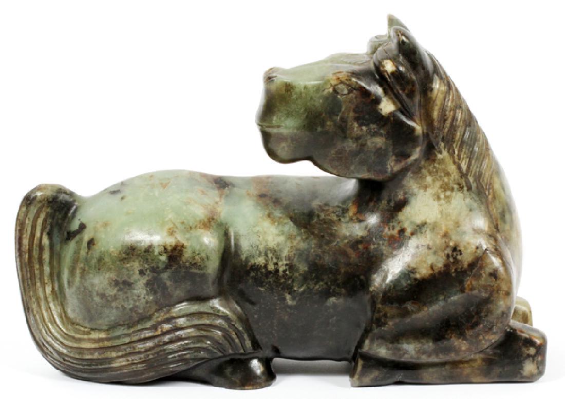 CHINESE NEPHRITE JADE SCULPTURE: CHINESE NEPHRITE JADE SCULPTURE, H 7", L 10", D 4"Nephrite jade sculpture of a reclining horse, c19th c. Unsigned.