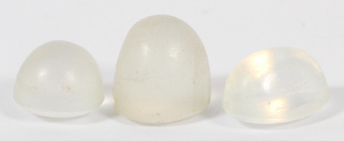 CABOCHON MOONSTONES, 3 PIECES: CABOCHON MOONSTONES, 3 PIECESUNMOUNTED. OVAL AND CIRCULAR CABOCHONS. THE FIRST STONE, DIA. 8.7MM. SECOND STONE DIA. 9.25MM TO 9.75MM OBLONG SHAPE.