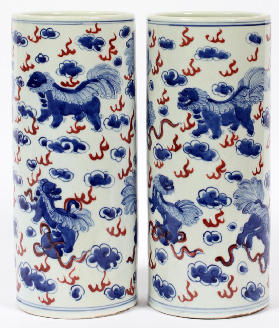 CHINESE PORCELAIN VASES, PAIR, H 12", DIA 5": CHINESE, PORCELAIN VASES, PAIR, H 12", DIA 5"cylinder shape, with blue foo lions and clouds on white ground with red accents.