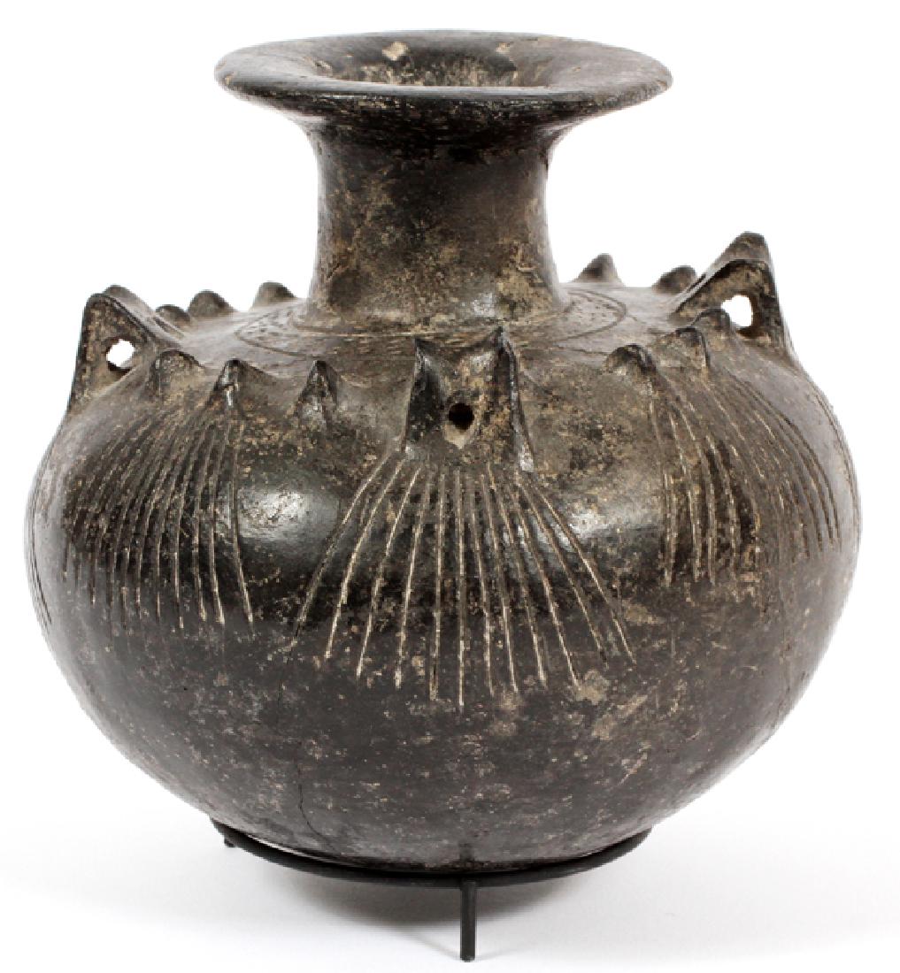 ANCIENT BURNISHED POTTERY VESSEL: ANCIENT BURNISHED POTTERY VESSEL, H 6 1/2", W 5 1/2" POSSIBLY FROM THE MEDITERRANEAN REGION, AGE UNKNOWN. WITH FLARED MOUTH AND ELONGATED NECK, THE BULBOUS BODY WITH FOUR RIBBED LUGS AND DECORATIVE KN