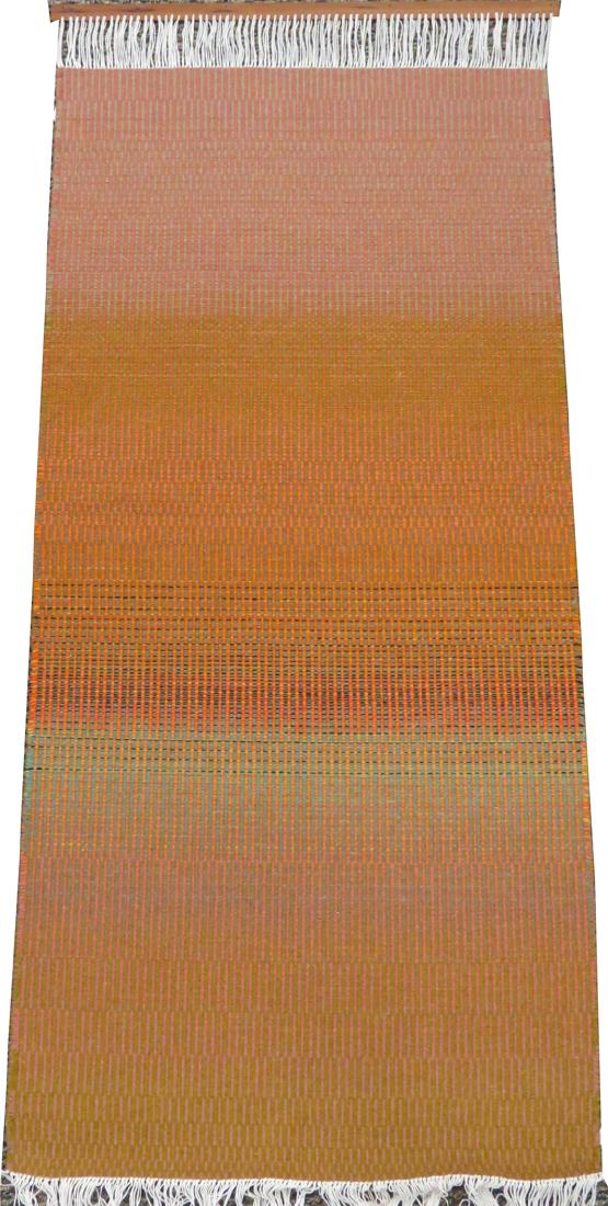 HEIJU OAK PACKARD WOOL WEAVING, W 2' 4", L 4' 11": HEIJU OAK PACKARD WOOL WEAVING, W 2' 4", L 4' 11"Hanging wool weaving, by the artist Heiju Oak Packard, in tones of yellow, orange, rust and green. Wooden stretcher bar at the top with a label on the 