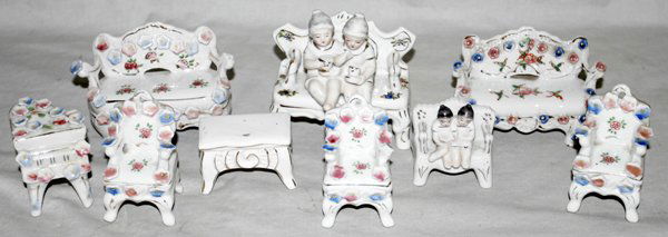 MINIATURE PORCELAIN FURNITURE, 9 PIECES: MINIATURE WHITE PORCELAIN FURNITURE, 9 PIECES, BENCHES, SETTEES, CHAIRS, PIANO:Flowers in relief.