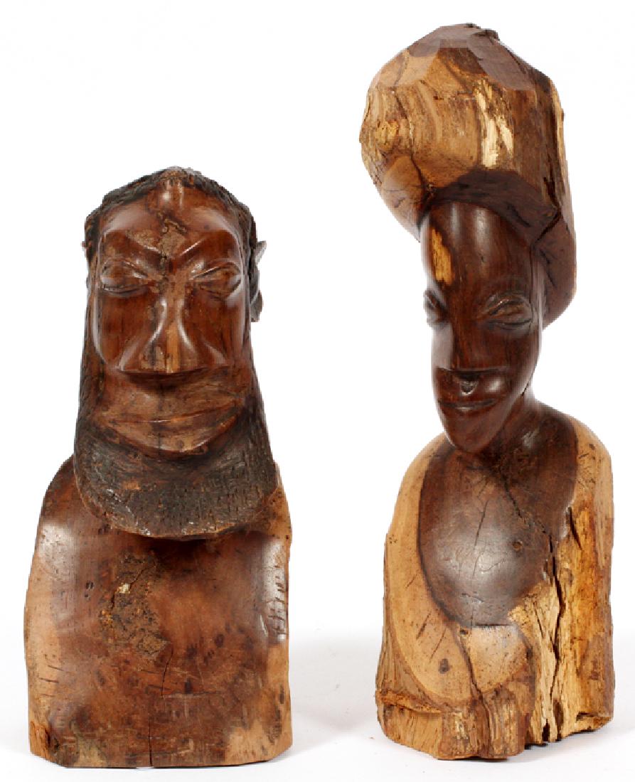 CARVED WOOD AFRICAN BUSTS, PAIR, H 7 1/2-9 1/2'': CARVED WOOD AFRICAN BUSTS, PAIR, H 7 1/2-9 1/2''A pair of African busts, the male measuring H 7 1/2'', and the female measuring H 9 1/2''. Most likely from the Malawi region.