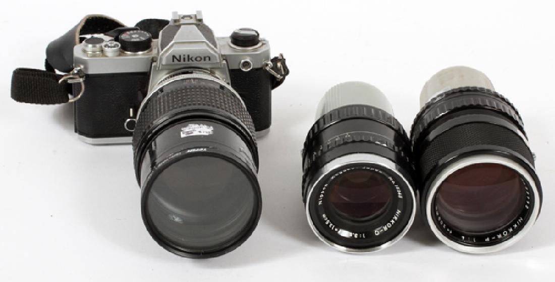 GROUP OF NIKON NIKKOR LENSES & FM CAMERA: GROUP OF NIKON NIKKOR LENSES & FM CAMERA, H 3 1/2"-6 7/8"Comprising: 1 Nikon Nikkor 180mm f=2.8 AF zoom lens, no. 361161, measuring 5 3/4" in length; 1 Nikon Nikkor-P 200mm f=4 non-AI telephoto lens,