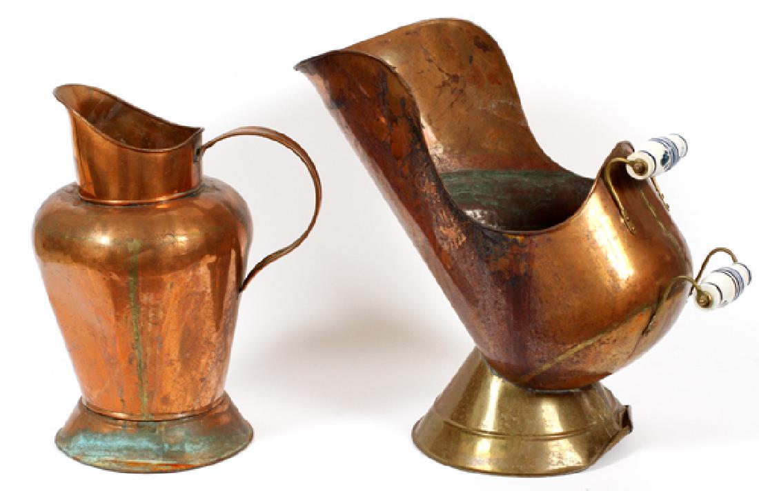 DUTCH COPPER COAL SCUTTLE AND PITCHER, H 15", 17": DUTCH COPPER COAL SCUTTLE AND PITCHER, H 15", 17"COPPER SCUTTLE WITH TWO DELFT POTTERY HANDLES AND BRASS BASE, CIRCA 1950. PLUS COPPER PITCHER WITH COPPER HOOP HANDLE AND ROUND TAPERED BRASS BASE.