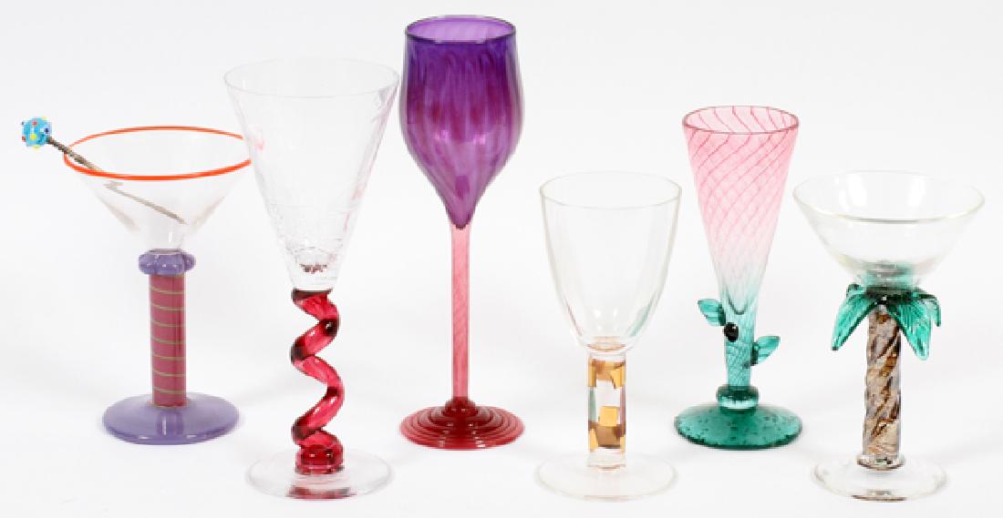 SIGNED MODERN ART GLASS COCKTAIL GLASSES: SIGNED MODERN ART GLASS COCKTAIL GLASSES, LATE 20TH C., 6 PCS., H 6 1/2"-9 3/8" Comprising: one Steve Smyers clear and gold hand-blown wine glass, one unsigned red and green glass with leafy stem, one