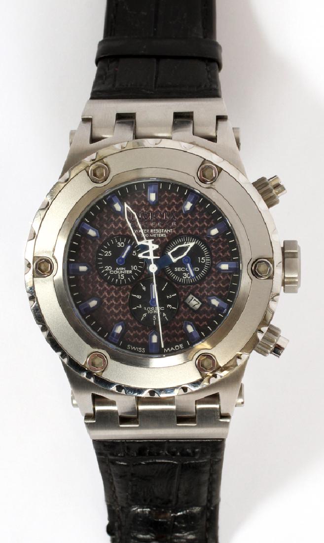 WRISTWATCH AND CASE: LADY'S/GENTS WRISTWATCH AND CASE, 1/10 SEC. 10 HR, THE 2ND-HAND MOVES, NO GUARANTEE, ONE WATCH, W 6", D 5", 'INVICTA' :No Guarantee - The second hand does move.