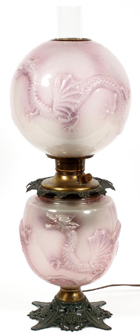 VICTORIAN MOLDED GLASS GONE WITH THE WIND OIL LAMP: VICTORIAN MOLDED GLASS GONE WITH THE WIND OIL LAMP, 19TH C., H 29" (APPROX.):The glass parts having a raised dragon motif with lavender tint. Electrified.