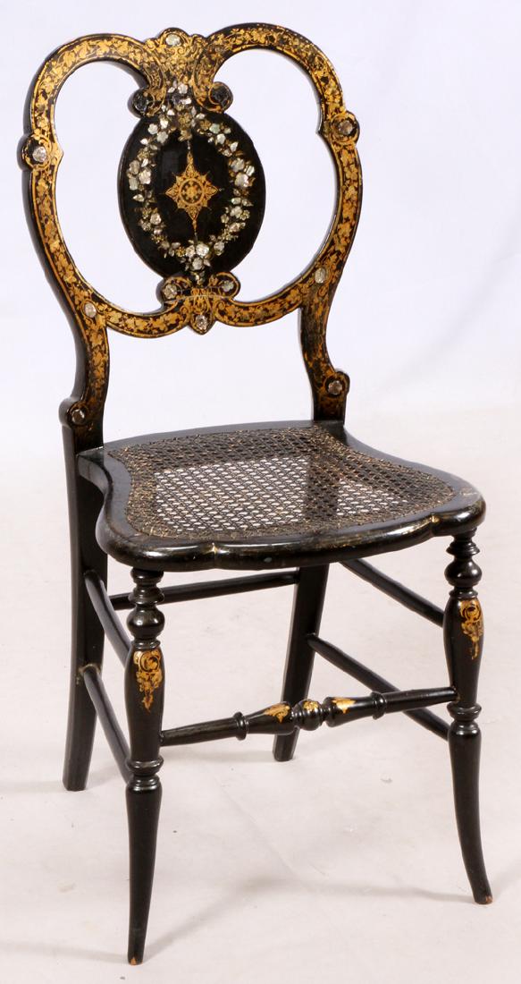 VICTORIAN LACQUERED & MOTHER-OF-PEARL SIDE CHAIR: VICTORIAN LACQUERED & MOTHER-OF-PEARL SIDE CHAIR, C. 1890, H 33 1/4", W 15 1/4", D 15":HAVING AN ARCHED INLAID CREST RAIL AND AN OVAL DECORATED SLAT, SURMOUNTING A CANED SEAT RAISED ON TURNED LEGS JOI