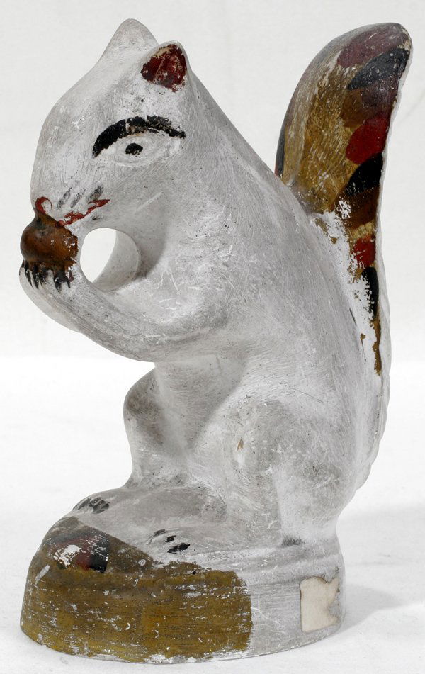 CHALKWARE FIGURE OF A SQUIRREL, 19TH C.: CHALKWARE FIGURE OF A SQUIRREL WITH NUT, LATE 19TH CENTURY, H 6 1/2":Hand-painted brown, dark red and black accents. Ex estate Walter Simmons, Grosse Pointe Farms, Mich.
