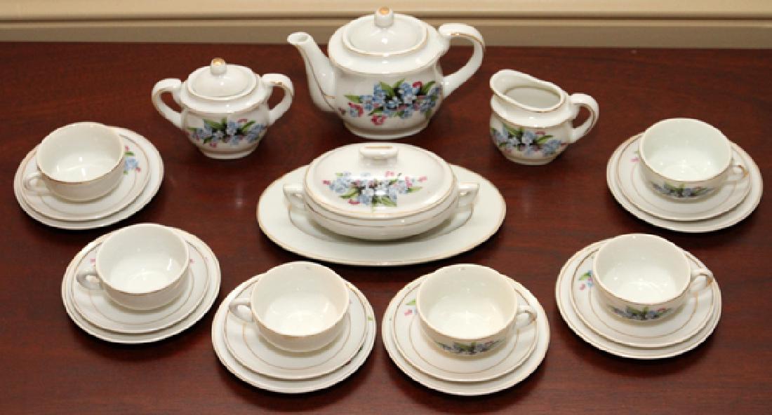 JAPANESE PAINTED PORCELAIN CHILD'S TEA SET: JAPANESE PAINTED PORCELAIN CHILD'S TEA SET, C. 1900, 23 PIECES:Painted with violet floral blossoms. Marked to underside. Circa 1900.From the Estate of Margaret Barton, Bloomfield Hills, Michigan.
