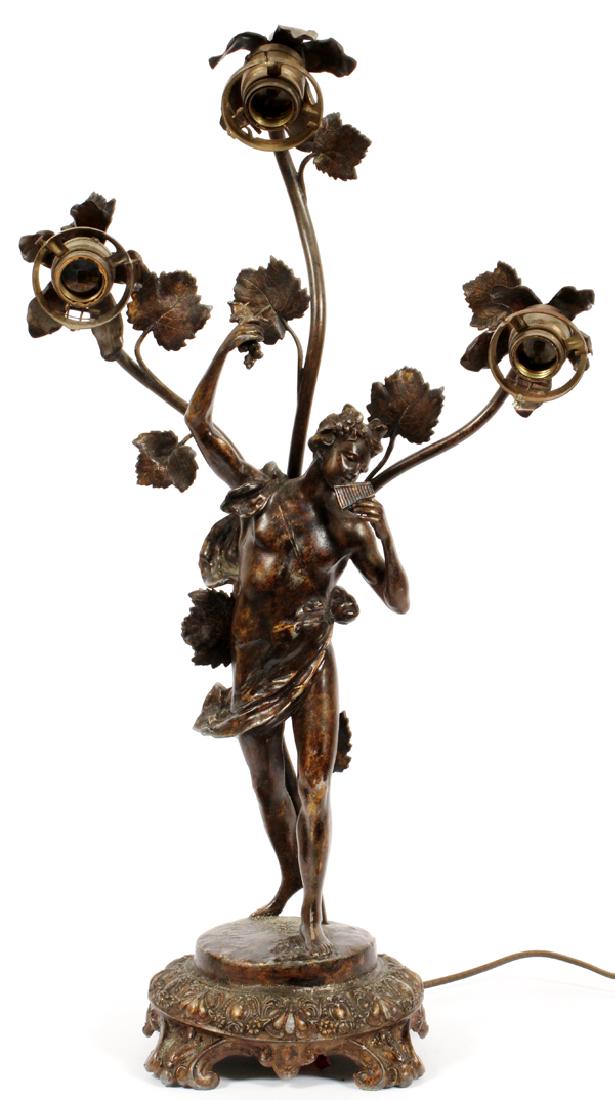 IN STYLE OF AUGUSTE MOREAU SPELTER FIGURAL LAMP: IN STYLE OF AUGUSTE MOREAU, (FRENCH, 1834-1913), SPELTER FIGURAL LAMP, H 25" :A figural lamp in the Art Nouveau style of a figure with a musical pipe; the work has three lights, and is electrified, 25