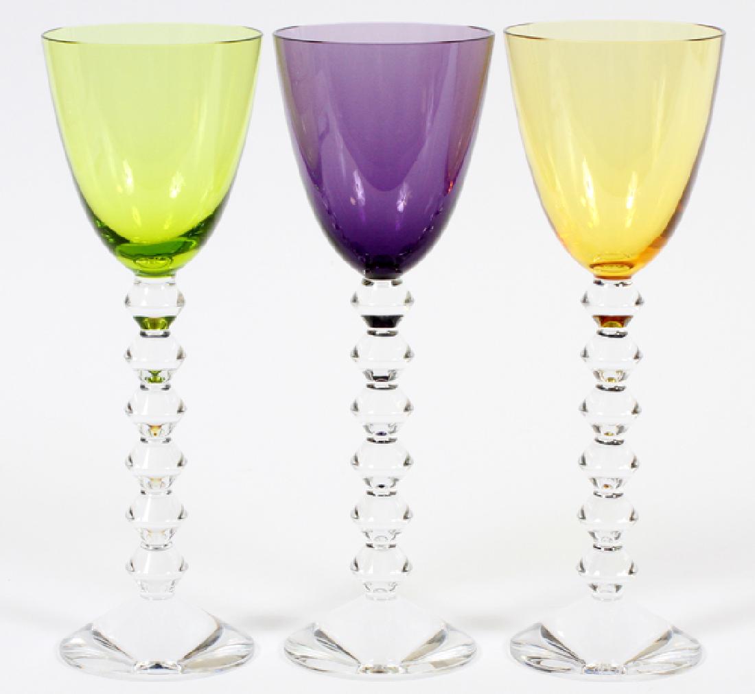 BACCARAT 'VEGA' BLOWN GLASS RHINE WINE GLASSES: BACCARAT 'VEGA' BLOWN GLASS RHINE WINE GLASSES, SET OF 3, H 9" :Composed of blown glass, with a diamond wafer stem, a set of three colored Rhine wine glasses in the "Vega" pattern by Baccarat. Colors 