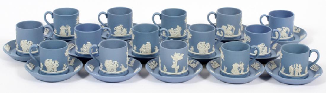WEDGWOOD DEMI TASSE CUPS AND SAUCERS 15: WEDGWOOD DEMI TASSE CUPS AND SAUCERS 15:Blue with white cameo. Thirty pieces. Cups H 2", Dia. 2". Saucers Dia. 4 1/4". From the Estate of Duncan MacLeod.